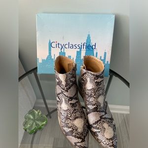 Snakeskin heeled boots